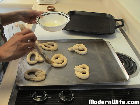 Brushing Pretzels with egg white glaze